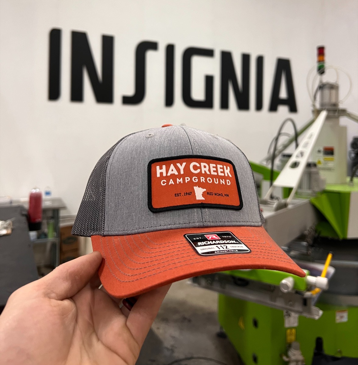 Richardson 112 trucker hat with a custom woven patch for Hay Creek Campground