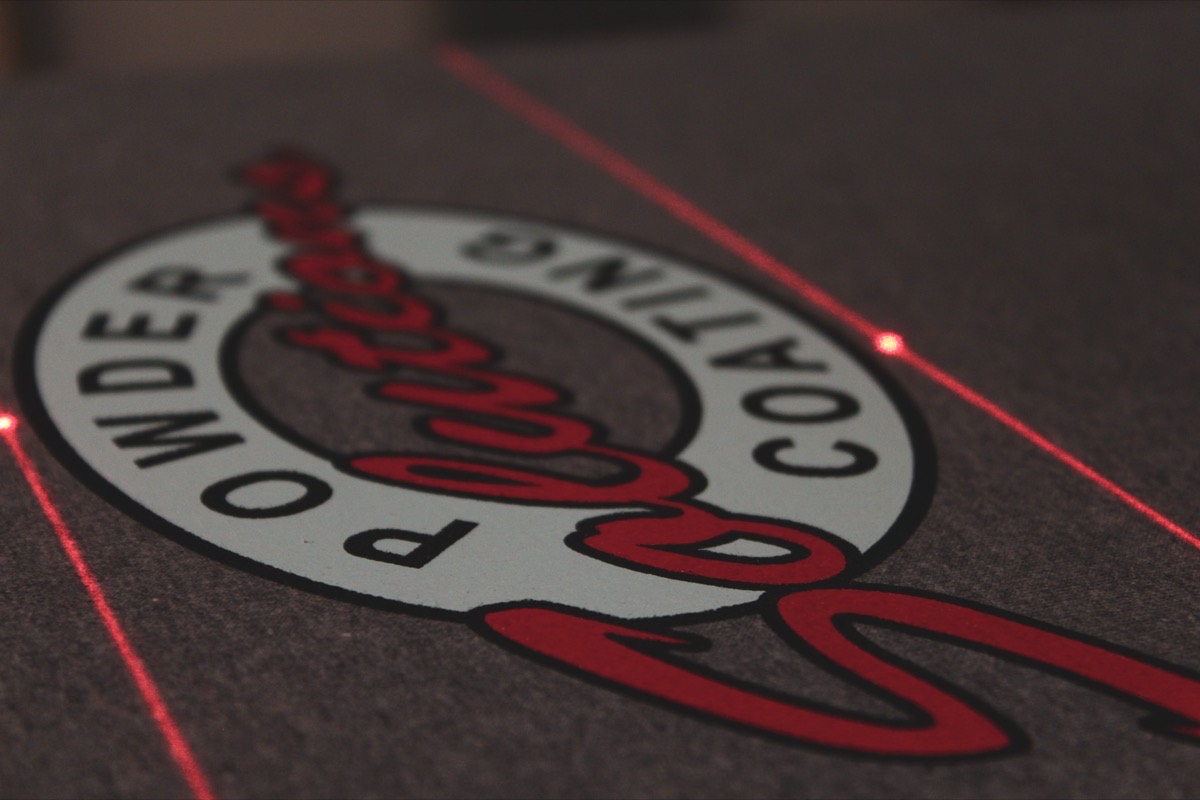 Close-up of a multi-color screen print on a heather t-shirt